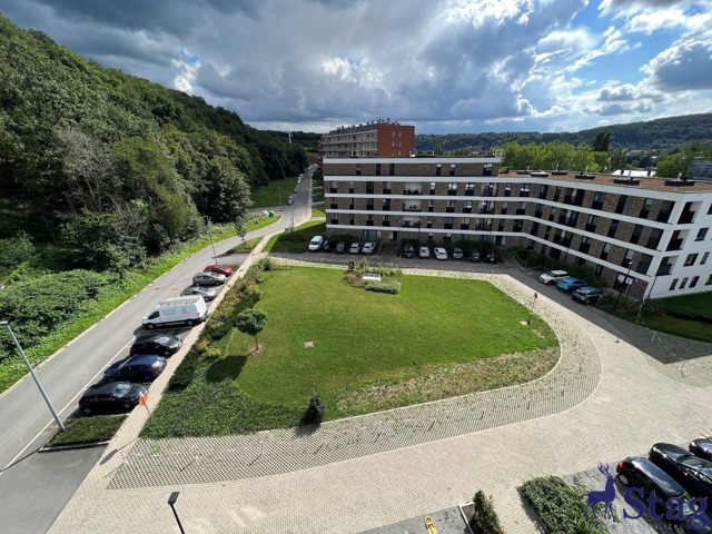 Penthouse 2 chambres avec terrasses, parking et cave