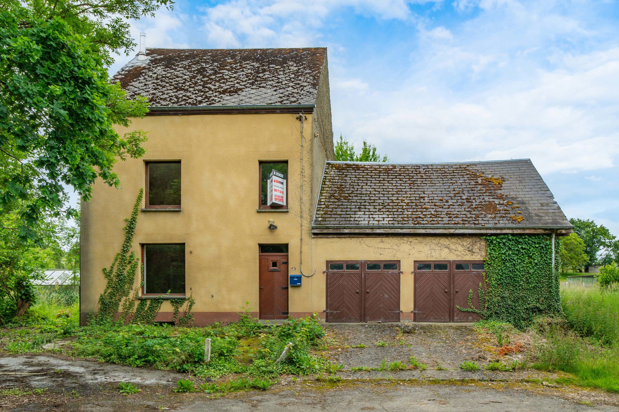 Photo maison Maison avec du potentiel + garages et 2333m² de terrain 